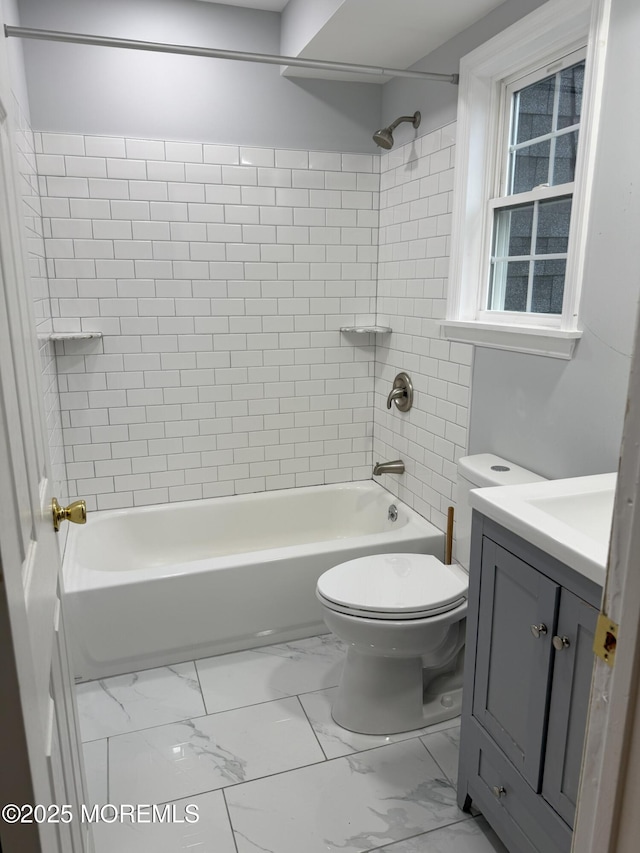 98 Beachway Ave Unit 9, Keansburg, NJ 07734 - bathroom featuring toilet, vanity, shower / tub combination, and marble look tiles