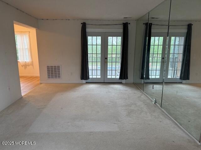98 Beachway Ave Unit 9, Keansburg, NJ 07734 - carpeted spare room with french doors and plenty of natural light
