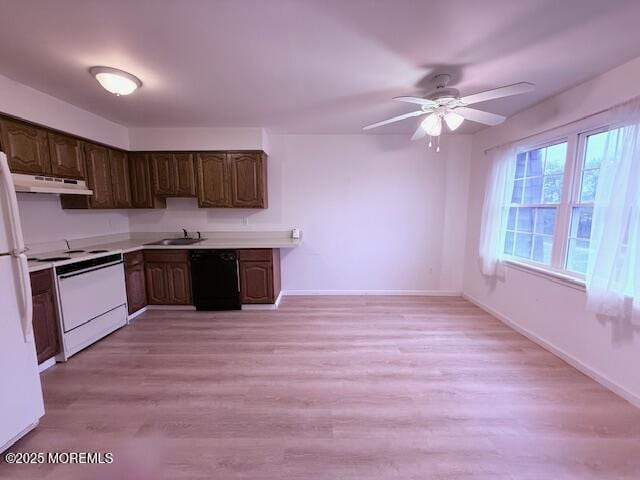 98 Beachway Ave Unit 9, Keansburg, NJ 07734 - kitchen featuring black dishwasher, range, under cabinet range hood, a sink, and light countertops