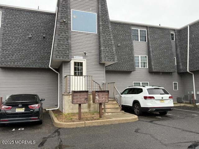 98 Beachway Ave Unit 9, Keansburg, NJ 07734 - view of front of home with roof with shingles and uncovered parking