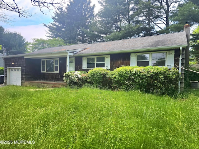 1305 Squirrel Rd, Wall, NJ 07719 - view of front of house with a chimney, an attached garage, central air condition unit, and a shingled roof
