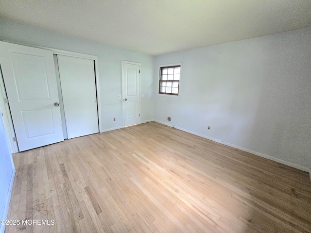 1305 Squirrel Rd, Wall, NJ 07719 - unfurnished bedroom featuring light wood-style flooring and baseboards