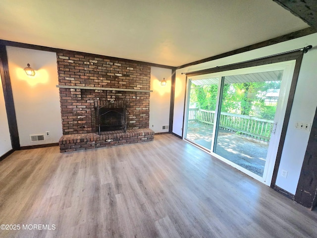 1305 Squirrel Rd, Wall, NJ 07719 - unfurnished living room with wood finished floors, baseboards, and a fireplace