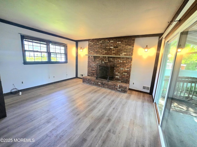 1305 Squirrel Rd, Wall, NJ 07719 - unfurnished living room featuring wood finished floors, baseboards, and a brick fireplace