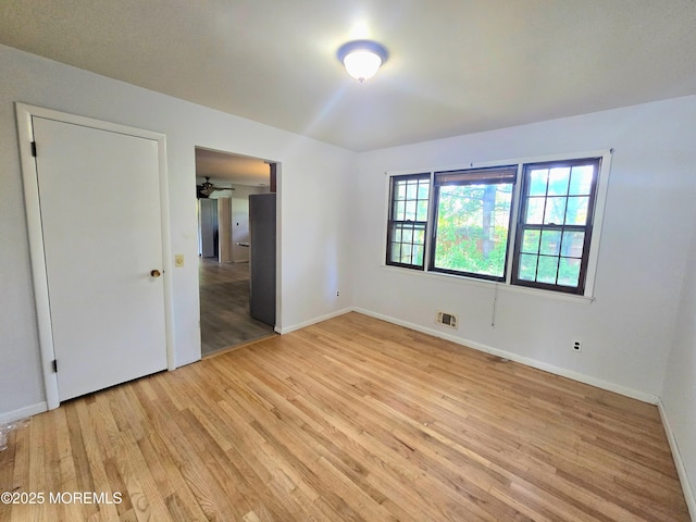 1305 Squirrel Rd, Wall, NJ 07719 - spare room featuring light wood-style floors, baseboards, and ceiling fan