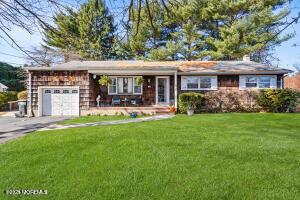 1305 Squirrel Rd, Wall, NJ 07719 - single story home with a front lawn, driveway, and a garage