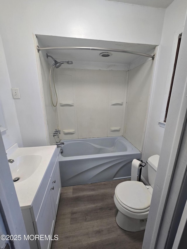 1305 Squirrel Rd, Wall, NJ 07719 - bathroom with wood finished floors, toilet, vanity, and tub / shower combination