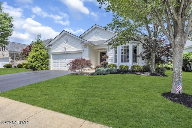 27 Cromwell Ln, Jackson, NJ 08527 - view of front of property with asphalt driveway, a front yard, and a garage