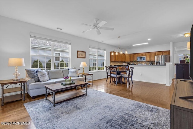 27 Cromwell Ln, Jackson, NJ 08527 - living area featuring a ceiling fan, light wood finished floors, baseboards, a chandelier, and recessed lighting