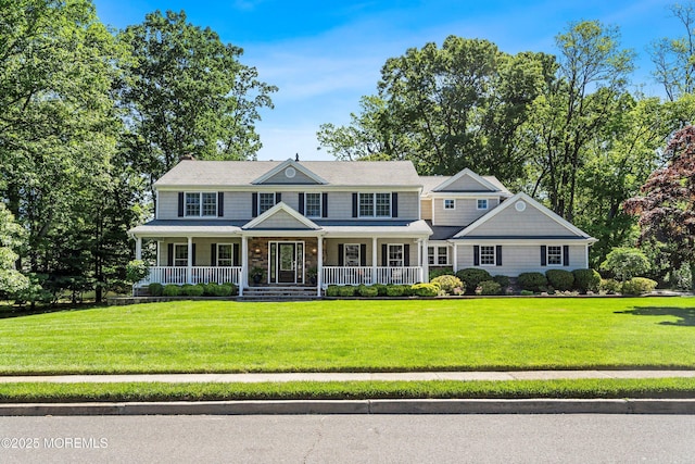 10 Woods Rd, West Long Branch, NJ 07764 - colonial home with a porch and a front lawn
