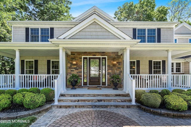 10 Woods Rd, West Long Branch, NJ 07764 - view of front of house with a porch and stone siding