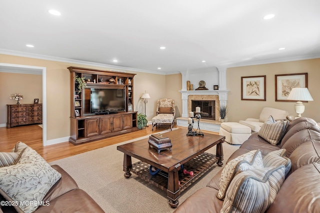 10 Woods Rd, West Long Branch, NJ 07764 - living room featuring recessed lighting, light wood-style floors, crown molding, a large fireplace, and baseboards