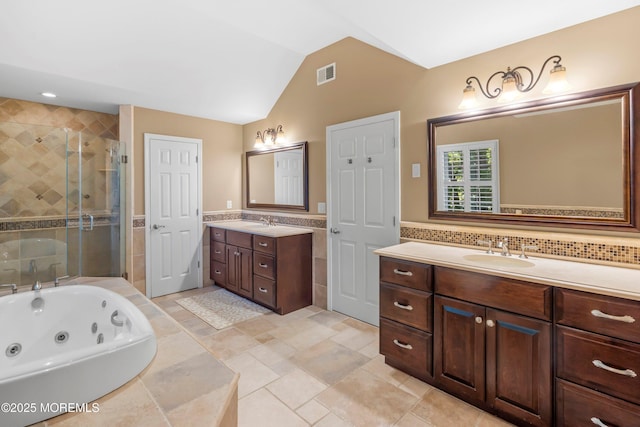 10 Woods Rd, West Long Branch, NJ 07764 - full bathroom featuring vanity, a shower stall, a whirlpool tub, tile walls, and vaulted ceiling
