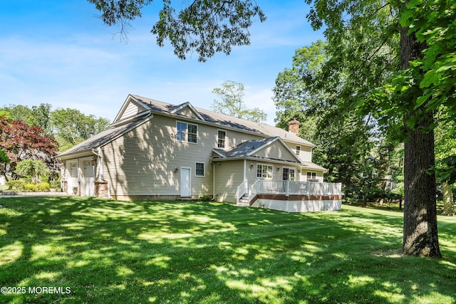 10 Woods Rd, West Long Branch, NJ 07764 - rear view of property with a lawn, a deck, a chimney, and an attached garage