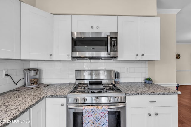 8 Brakenbury Ct, Toms River, NJ 08757 - kitchen featuring stainless steel appliances, ornamental molding, white cabinetry, and light stone counters
