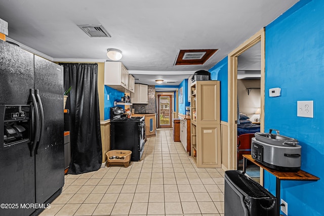 12 Central Ave, Waretown, NJ 08758 - kitchen featuring black appliances, light tile patterned flooring, and white cabinetry