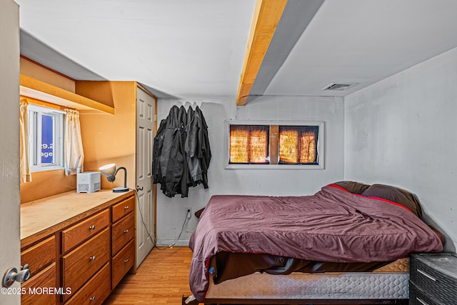 12 Central Ave, Waretown, NJ 08758 - bedroom with light wood-style floors and beamed ceiling