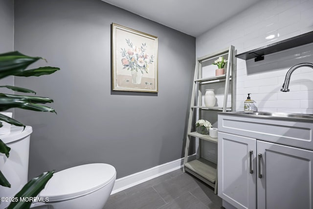 2594 Mountain Ave, Scotch Plains, NJ 07076 - half bath featuring toilet, tasteful backsplash, baseboards, vanity, and tile patterned flooring
