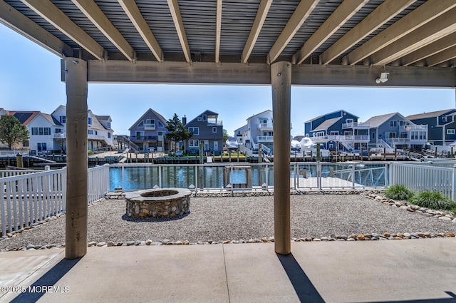 43 S Ensign Dr, Little Egg Harbor, NJ 08087 - view of patio / terrace with a residential view, a fire pit, and a water view