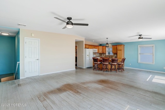 43 S Ensign Dr, Little Egg Harbor, NJ 08087 - living room with ceiling fan, baseboards, and light wood-style flooring