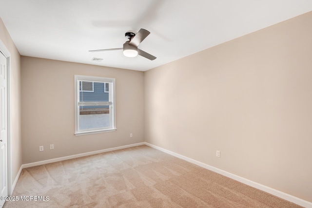 43 S Ensign Dr, Little Egg Harbor, NJ 08087 - empty room with a ceiling fan, light colored carpet, and baseboards