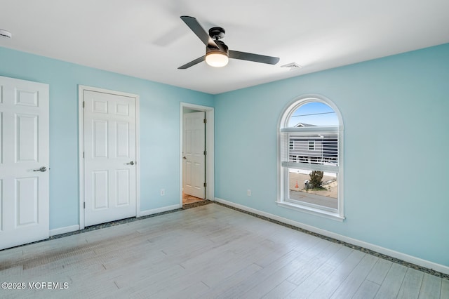 43 S Ensign Dr, Little Egg Harbor, NJ 08087 - unfurnished bedroom featuring wood finished floors, baseboards, and ceiling fan