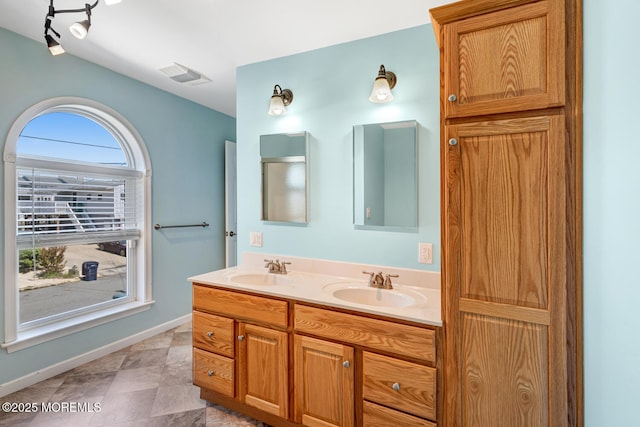 43 S Ensign Dr, Little Egg Harbor, NJ 08087 - bathroom featuring double vanity and baseboards