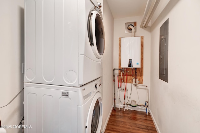 43 S Ensign Dr, Little Egg Harbor, NJ 08087 - laundry room with stacked washer / drying machine, water heater, wood finished floors, baseboards, and electric panel
