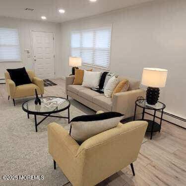 8 Rio Ct, Toms River, NJ 08757 - living room with recessed lighting and light wood-style floors