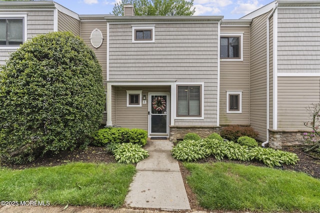 8 Fern Ct, Tinton Falls, NJ 07724 - view of front of home with a chimney and stone siding