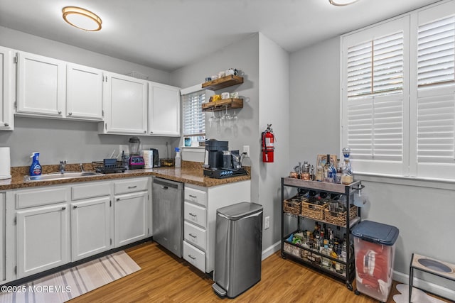 8 Fern Ct, Tinton Falls, NJ 07724 - kitchen featuring a sink, stainless steel dishwasher, light wood-type flooring, white cabinetry, and open shelves