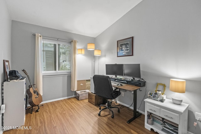 8 Fern Ct, Tinton Falls, NJ 07724 - home office with light wood-style flooring, vaulted ceiling, and baseboards