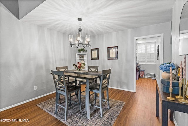 8 Fern Ct, Tinton Falls, NJ 07724 - dining room featuring a chandelier, wood finished floors, and baseboards