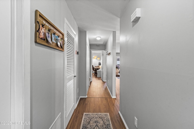 8 Fern Ct, Tinton Falls, NJ 07724 - hallway featuring dark wood-style floors and baseboards