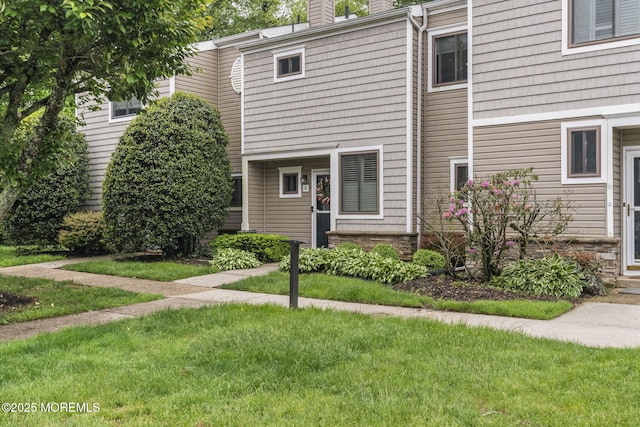8 Fern Ct, Tinton Falls, NJ 07724 - view of property with a chimney and a front lawn