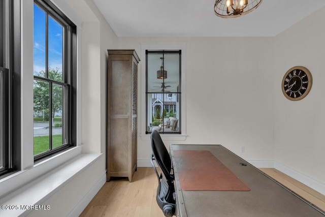 2110 Edgewood Pl, Spring Lake, NJ 07762 - home office featuring light wood-style flooring, healthy amount of natural light, a chandelier, and baseboards