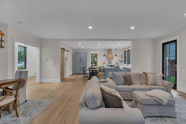 2110 Edgewood Pl, Spring Lake, NJ 07762 - living area with a barn door, light wood finished floors, baseboards, and recessed lighting