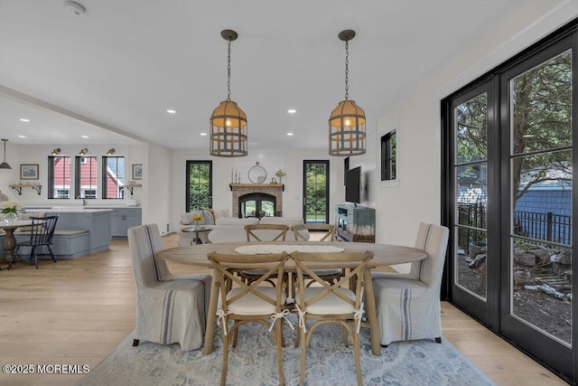 2110 Edgewood Pl, Spring Lake, NJ 07762 - dining area featuring light wood-type flooring, recessed lighting, and a brick fireplace
