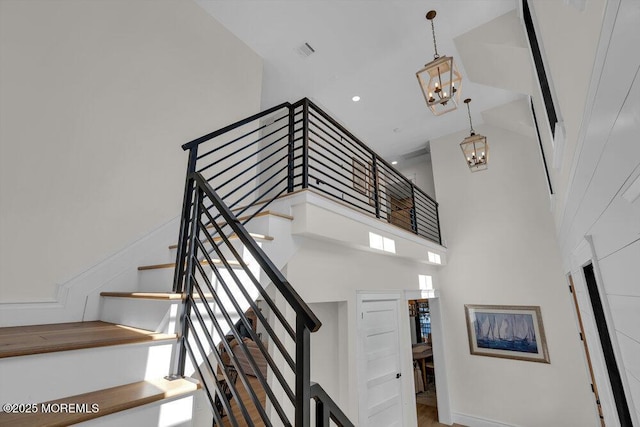 2110 Edgewood Pl, Spring Lake, NJ 07762 - stairway with a chandelier and a high ceiling