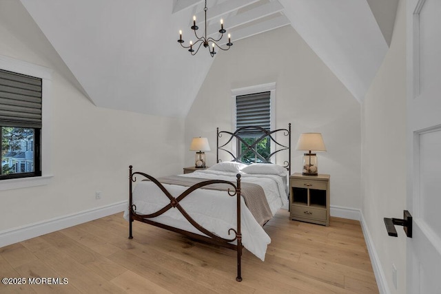 2110 Edgewood Pl, Spring Lake, NJ 07762 - bedroom with lofted ceiling, light wood-style floors, a chandelier, and baseboards