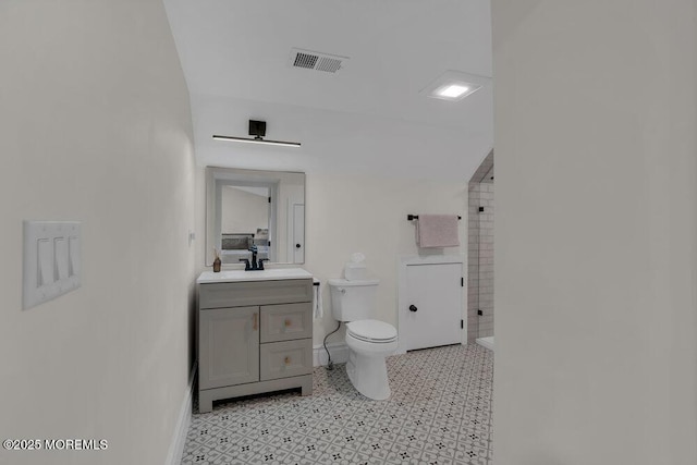 2110 Edgewood Pl, Spring Lake, NJ 07762 - bathroom featuring a tile shower, vanity, toilet, and baseboards