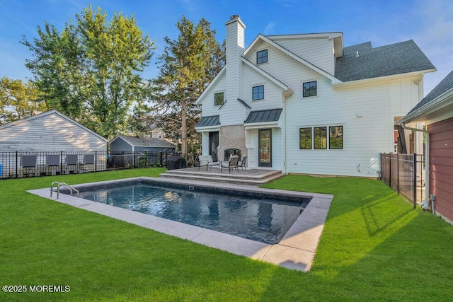 2110 Edgewood Pl, Spring Lake, NJ 07762 - rear view of house featuring a chimney, a standing seam roof, and metal roof