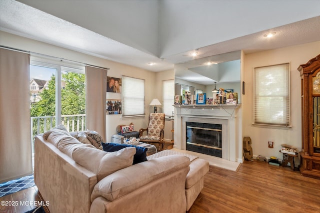340 E Lacey Rd Unit 40, Forked River, NJ 08731 - living area with wood finished floors, a premium fireplace, and recessed lighting