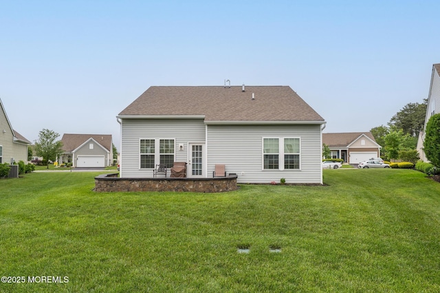 39 Addlestone Ln, Manchester, NJ 08759 - rear view of house featuring a yard and roof with shingles