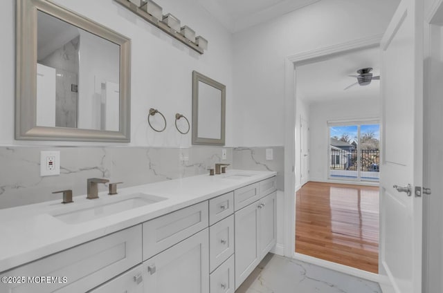 1 Private Dr, Elberon, NJ 07740 - bathroom with marble look tile flooring, double vanity, and baseboards