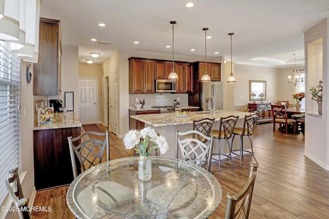 24 Moonlight Way, Howell, NJ 07731 - dining area featuring recessed lighting, wood finished floors, and baseboards