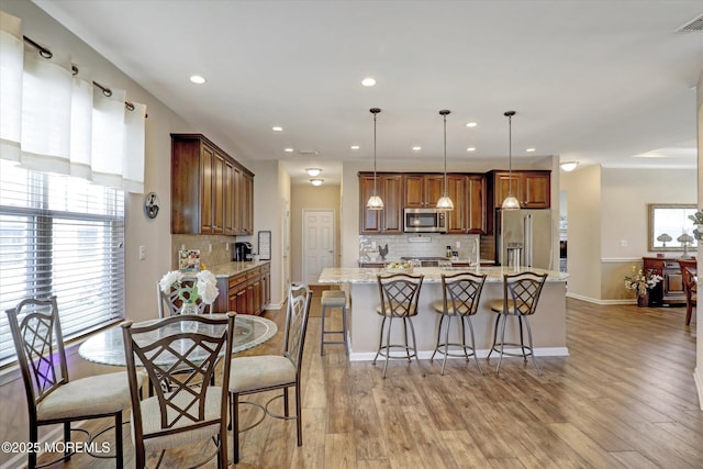 24 Moonlight Way, Howell, NJ 07731 - dining space with recessed lighting, light wood finished floors, and baseboards