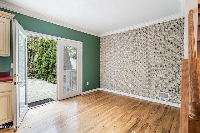 146 Inskip Ave, Ocean Grove, NJ 07756 - unfurnished room featuring crown molding, wallpapered walls, light wood-style floors, baseboards, and an accent wall