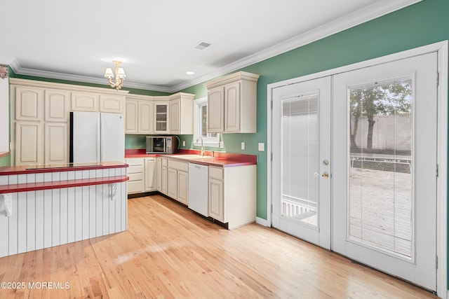 146 Inskip Ave, Ocean Grove, NJ 07756 - kitchen featuring white appliances, a sink, ornamental molding, a chandelier, and light wood-style floors
