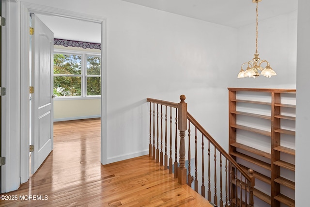 146 Inskip Ave, Ocean Grove, NJ 07756 - staircase with wood finished floors, a chandelier, and baseboards